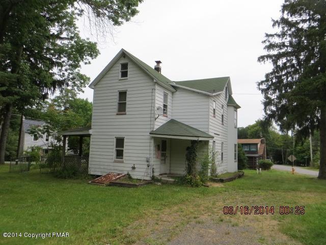 126 Monomonock Road Cresco, PA 18326 - Photo 3 of 9 a front view of a house with a garden