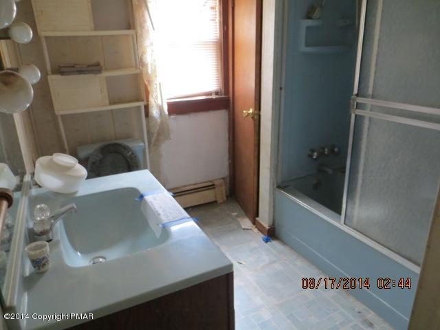 126 Monomonock Road Cresco, PA 18326 - Photo 8 of 9 a bathroom with a sink and toilet