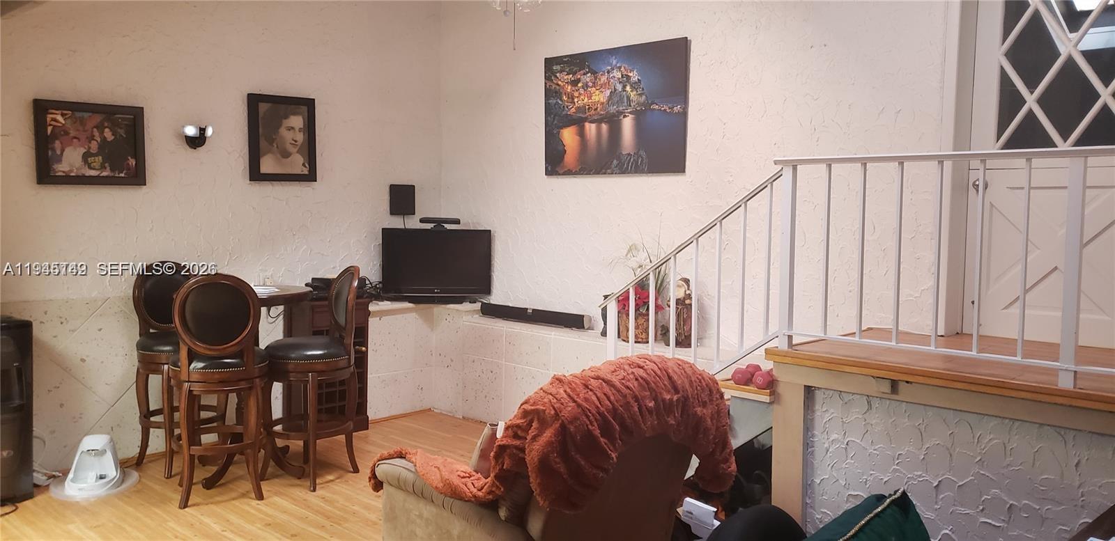 3426 Spring Bluff Place, Unit 36 Lauderhill, FL 33319 - Photo 3 of 14 a living room with furniture and a chair