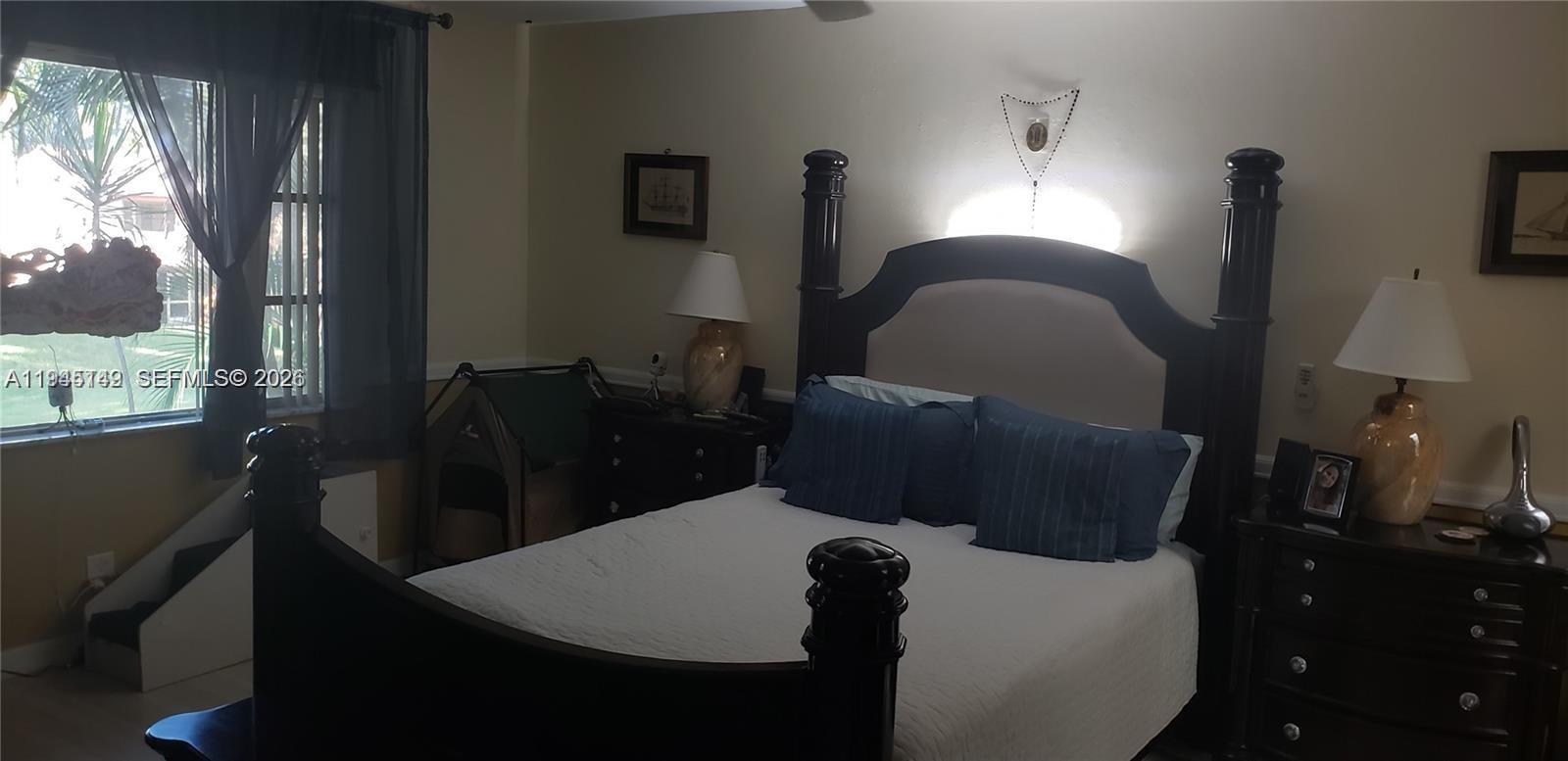 3426 Spring Bluff Place, Unit 36 Lauderhill, FL 33319 - Photo 5 of 14 a living room with furniture and a window