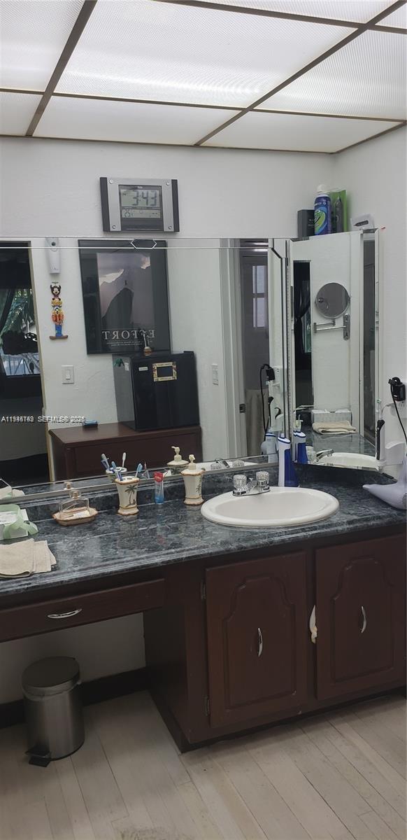 3426 Spring Bluff Place, Unit 36 Lauderhill, FL 33319 - Photo 9 of 14 a bathroom with a granite countertop double vanity sink and a mirror