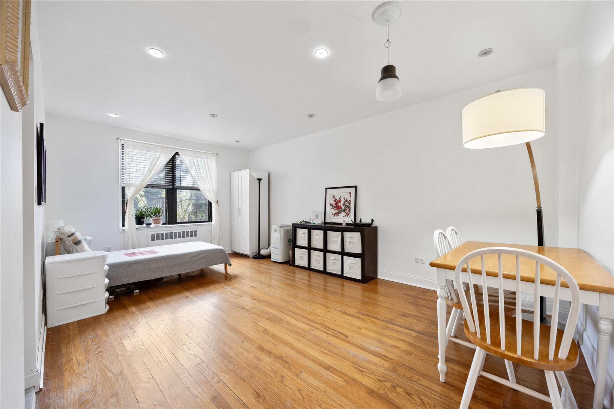 150-25 72nd Road, Unit 3H Queens, NY 11367 - Photo 1 of 1 Bedroom with light wood-style floors, radiator heating unit, and recessed lighting