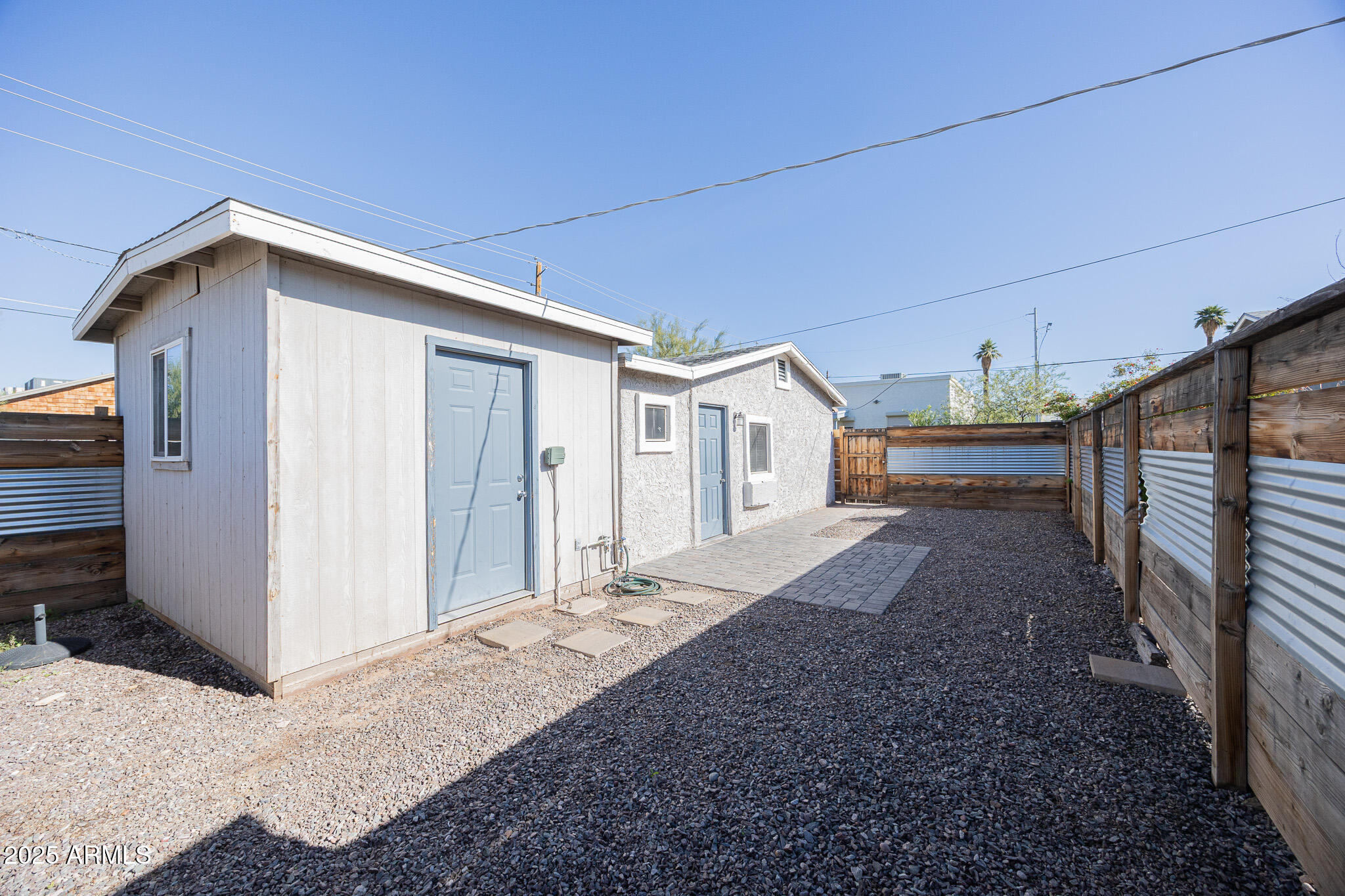 1026 East Pierce Street, Unit B Phoenix, AZ 85006 - Photo 1 of 14 a view of a house with backyard and roof