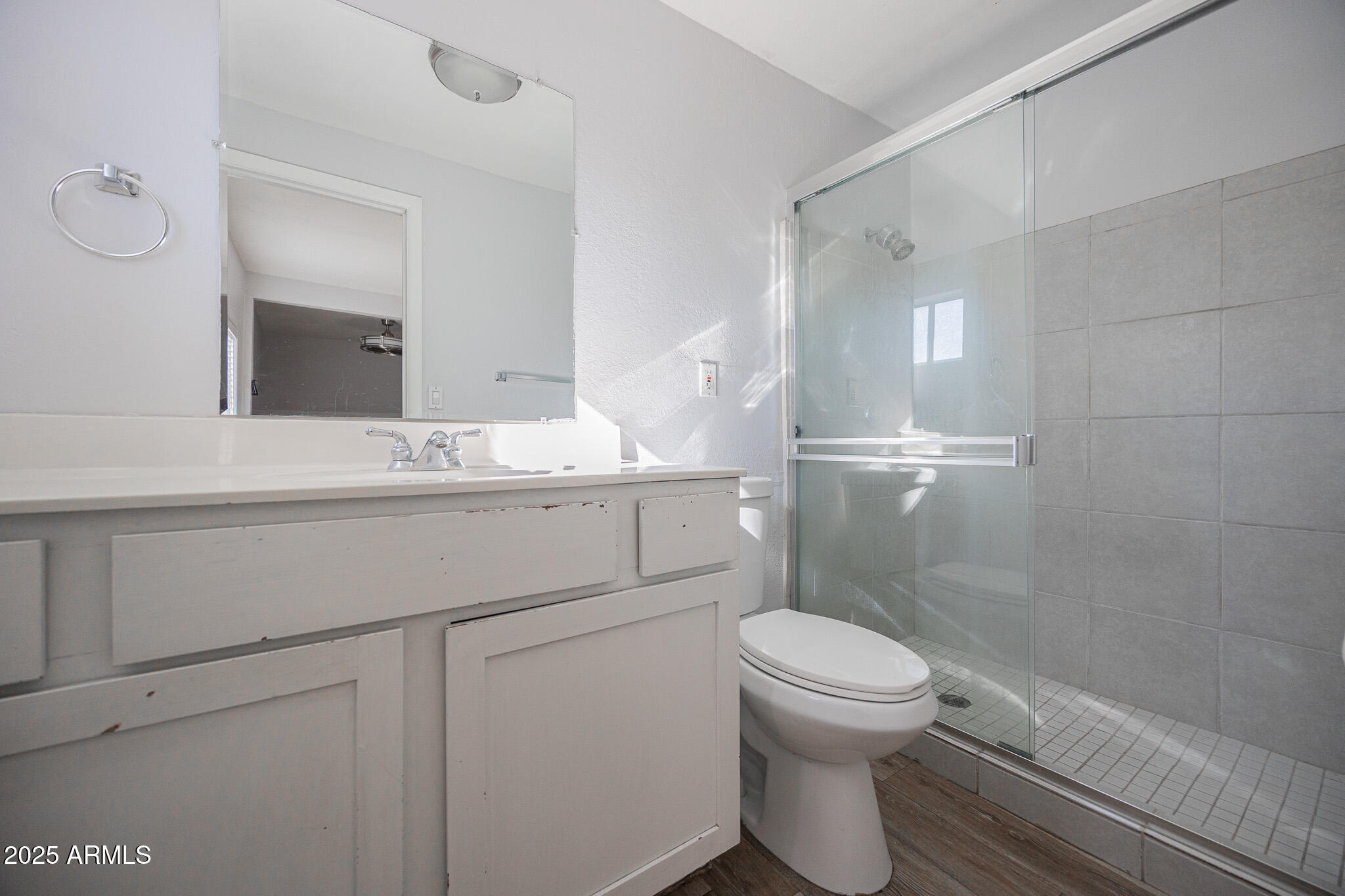 1026 East Pierce Street, Unit B Phoenix, AZ 85006 - Photo 13 of 14 a bathroom with a sink a toilet and a mirror