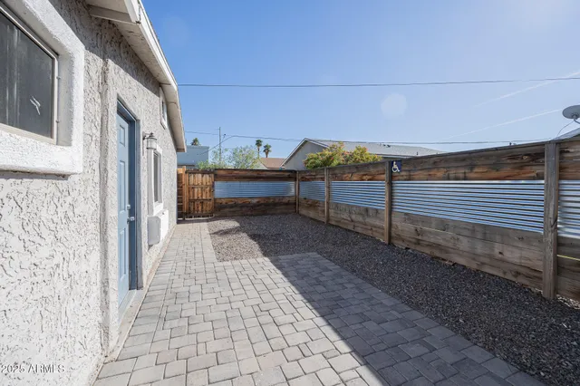 a view of a pathway with a backyard