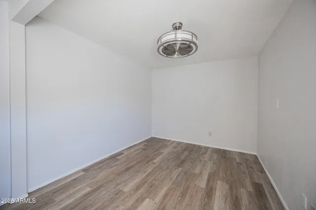 a view of a small space with wooden floor