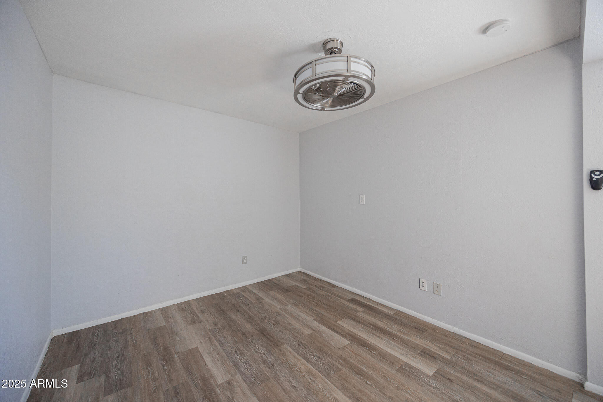 1026 East Pierce Street, Unit B Phoenix, AZ 85006 - Photo 9 of 14 a view of a room that has a fan