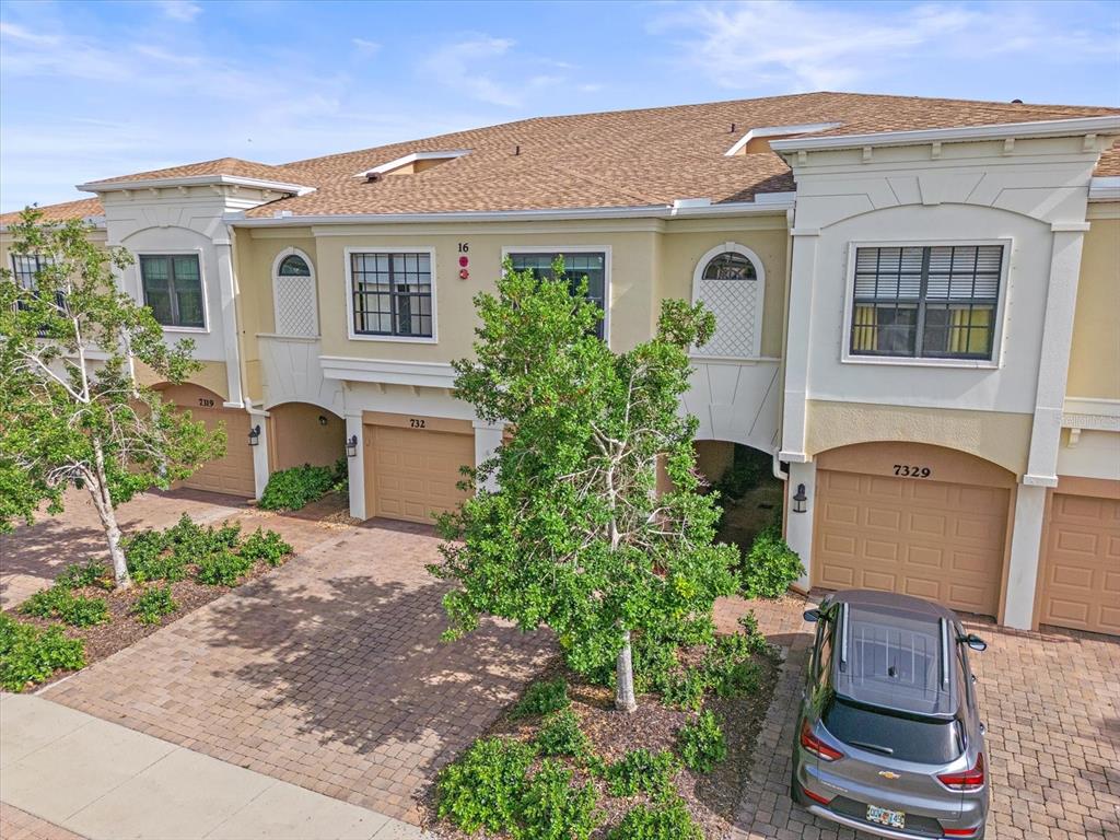 7325 Skybird Road, Unit 399 Bradenton, FL 34209 - Photo 1 of 49 a front view of a house with garden