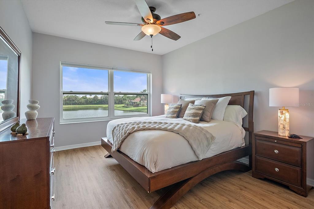 7325 Skybird Road, Unit 399 Bradenton, FL 34209 - Photo 22 of 49 a bedroom with a bed and a large window