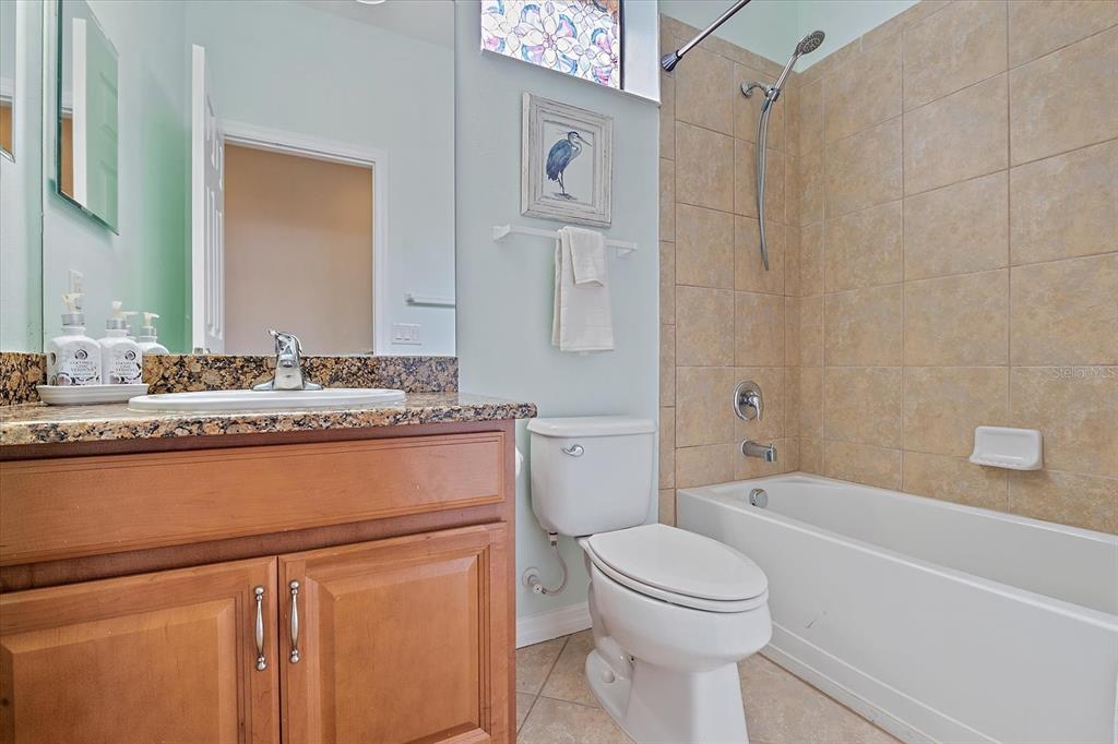 7325 Skybird Road, Unit 399 Bradenton, FL 34209 - Photo 32 of 49 a bathroom with a sink a toilet and a bathtub