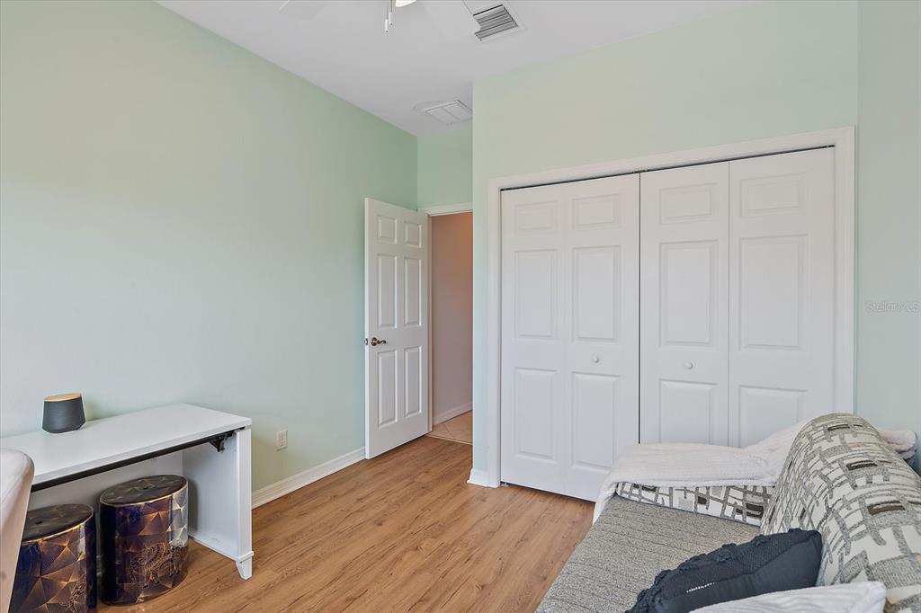 7325 Skybird Road, Unit 399 Bradenton, FL 34209 - Photo 35 of 49 a view of bedroom with a bed and hallway