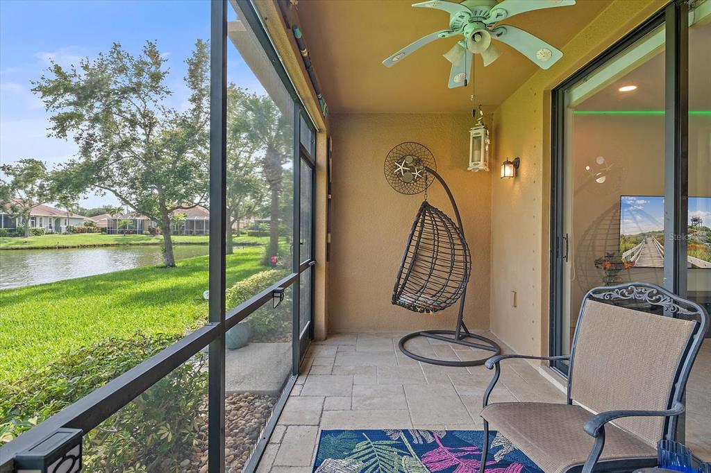 7325 Skybird Road, Unit 399 Bradenton, FL 34209 - Photo 37 of 49 a view of a balcony with chair and table