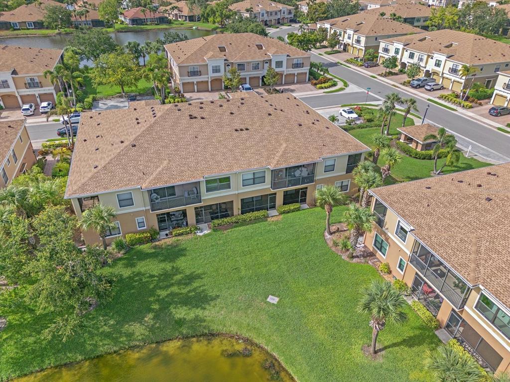 7325 Skybird Road, Unit 399 Bradenton, FL 34209 - Photo 41 of 49 an aerial view of multiple houses with yard