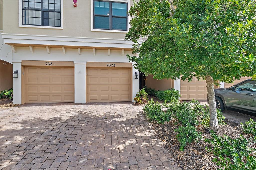 7325 Skybird Road, Unit 399 Bradenton, FL 34209 - Photo 44 of 49 a house that has a tree in front of it
