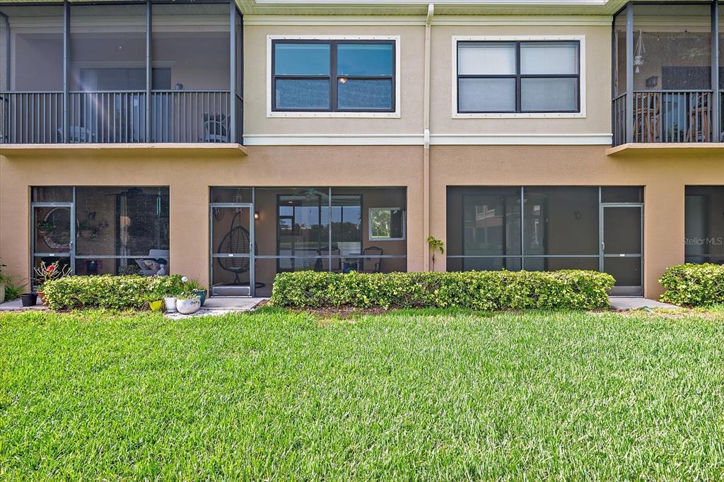 7325 Skybird Road, Unit 399 Bradenton, FL 34209 - Photo 45 of 49 a view of brick building with a yard