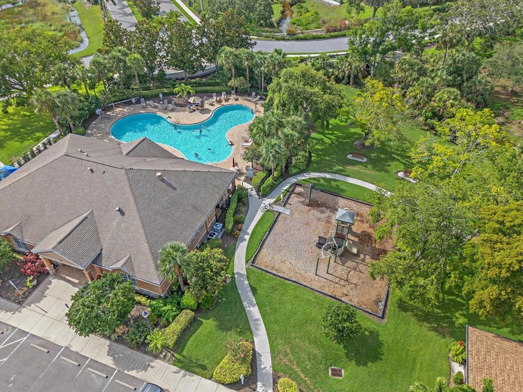 7325 Skybird Road, Unit 399 Bradenton, FL 34209 - Photo 47 of 49 an aerial view of a swimming pool a yard and mountain view in back