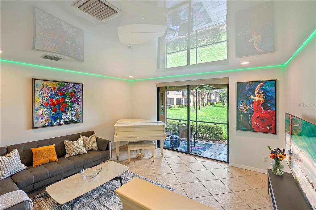 7325 Skybird Road, Unit 399 Bradenton, FL 34209 - Photo 9 of 49 a living room with furniture a rug and a window