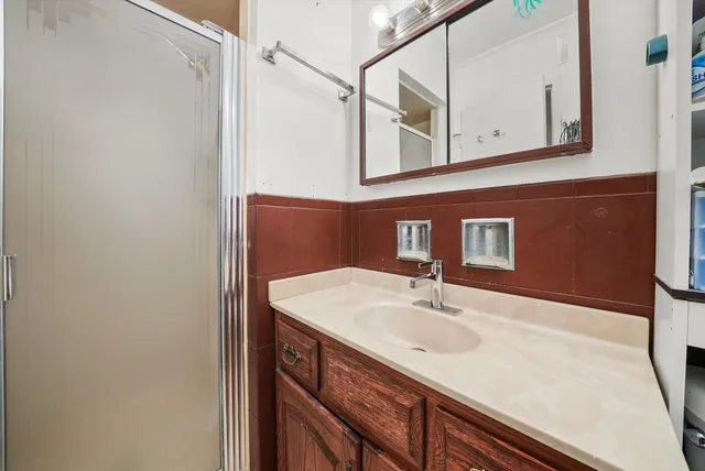a bathroom with a sink and a mirror
