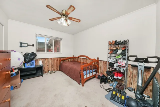 a living room with furniture and a gym