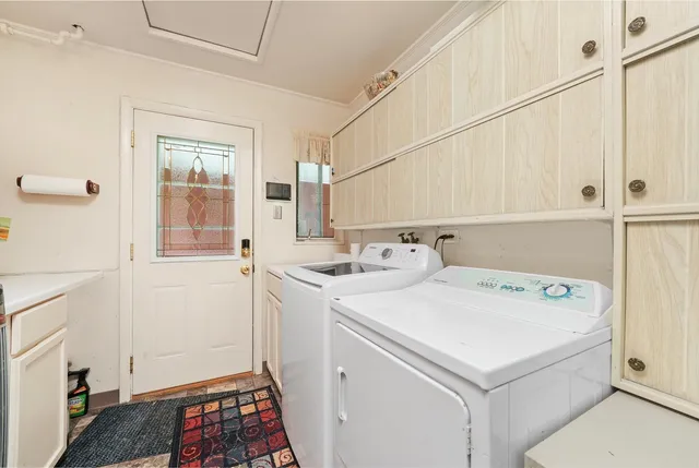 a utility room with dryer and washer