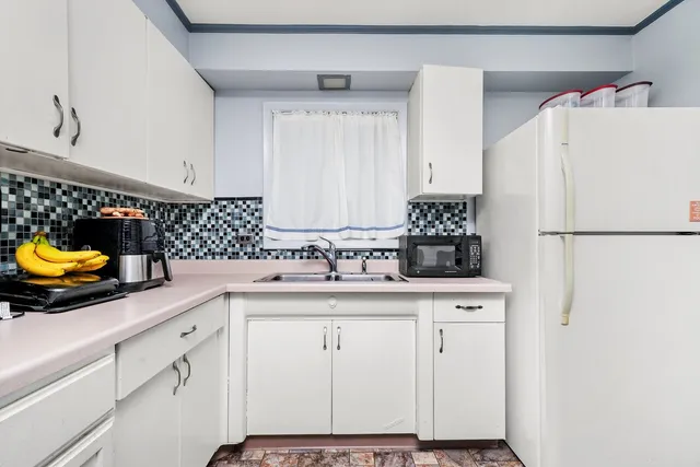 a kitchen with a sink and cabinets