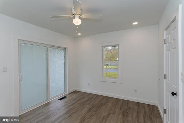 a view of front door and wooden floor