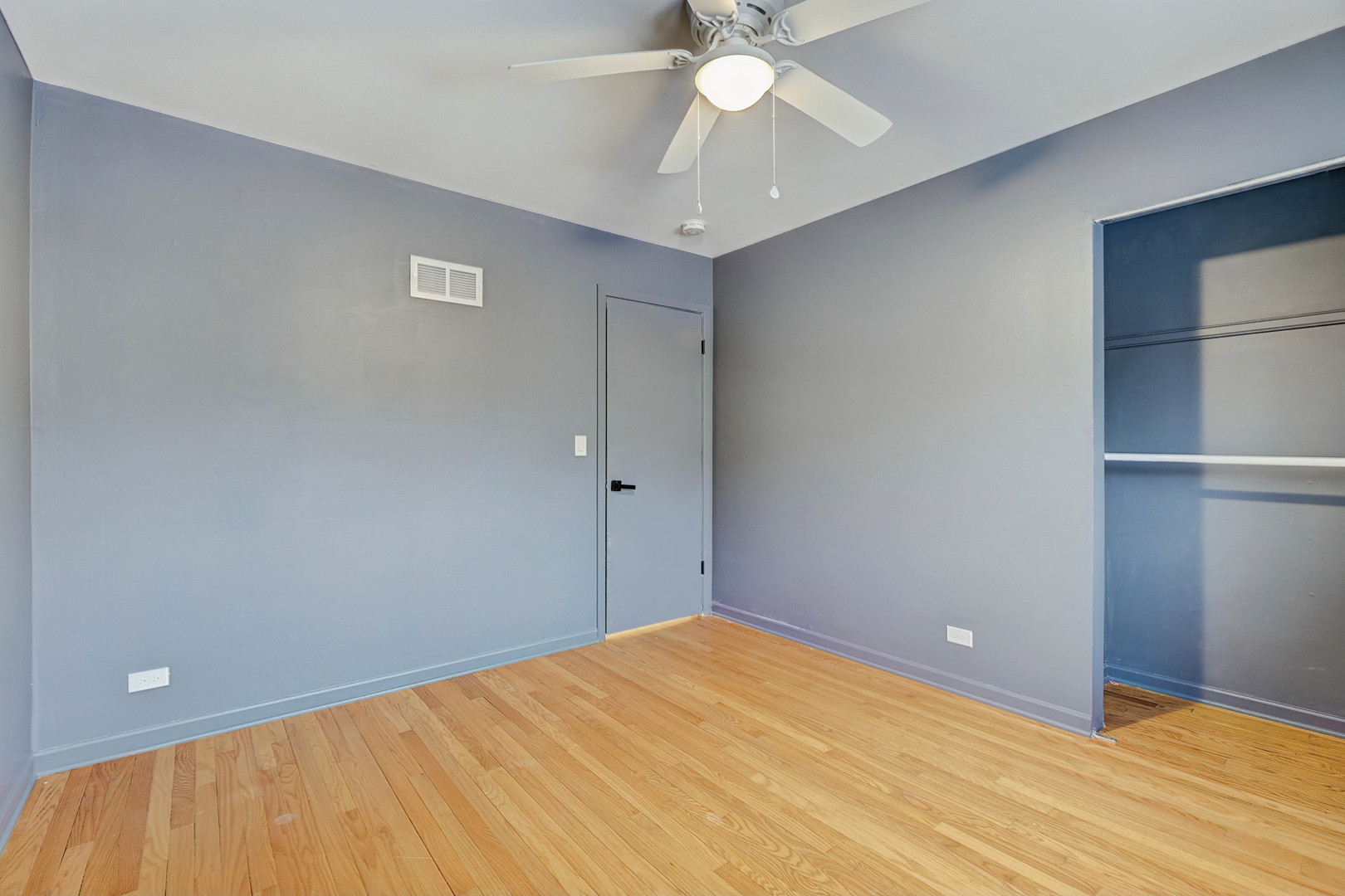 1343 Oxford Road Deerfield, IL 60015 - Photo 20 of 28 a view of an empty room with a chandelier fan