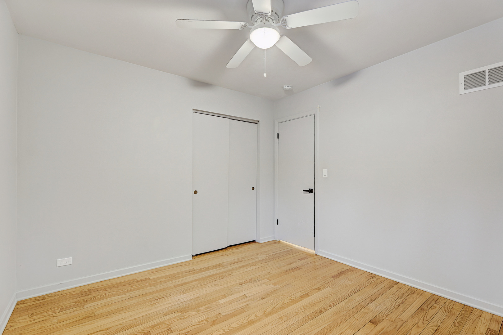 1343 Oxford Road Deerfield, IL 60015 - Photo 22 of 28 wooden floor in an empty room