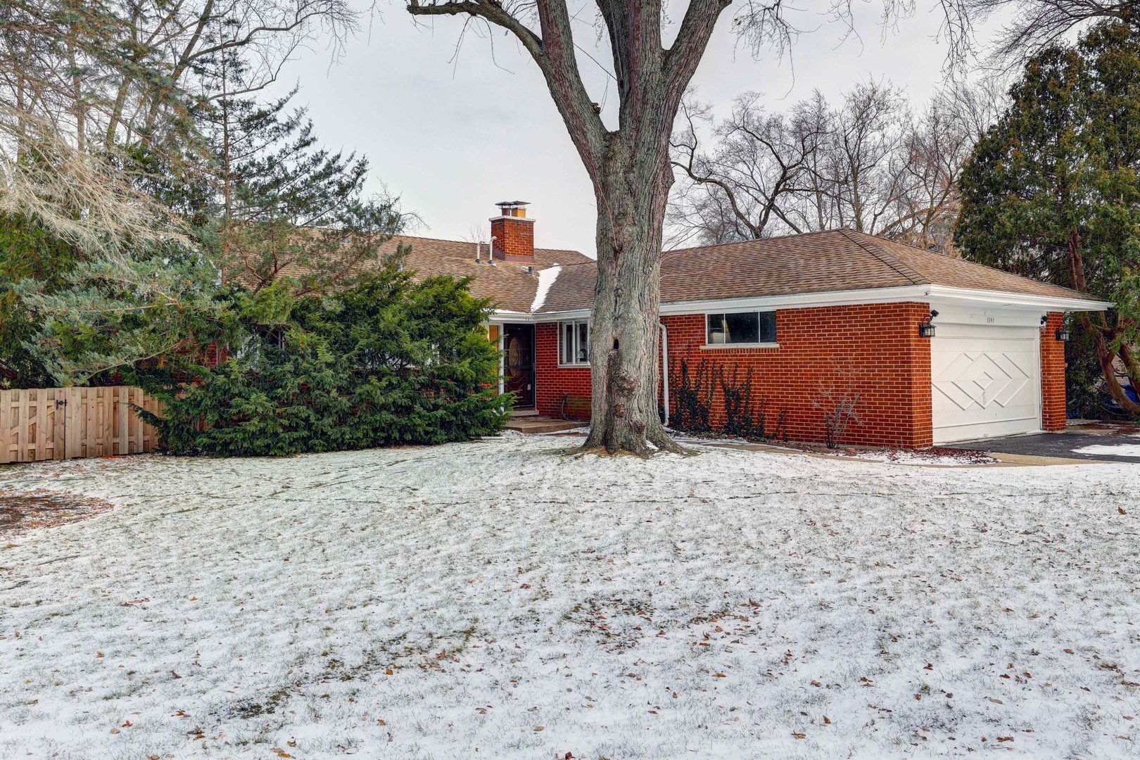 1343 Oxford Road Deerfield, IL 60015 - Photo 28 of 28 a front view of a house with a yard and garage