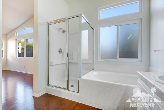 841 Homestead Road Corona, CA 92878 - Photo 11 of 21 a bathroom with a bathtub and a shower
