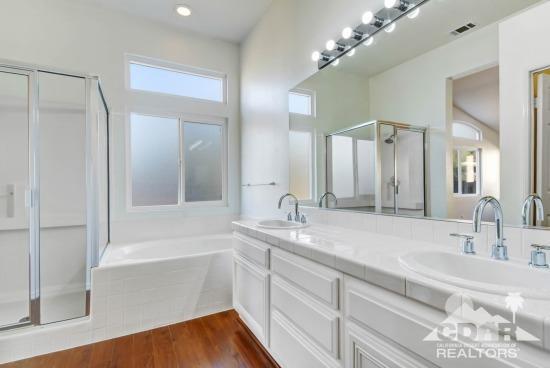 841 Homestead Road Corona, CA 92878 - Photo 12 of 21 a bathroom with a tub sink and mirror