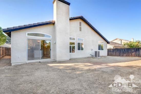841 Homestead Road Corona, CA 92878 - Photo 19 of 21 a view of a house with backyard and trees