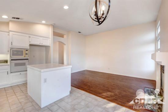 841 Homestead Road Corona, CA 92878 - Photo 6 of 21 a kitchen with a stove and a microwave