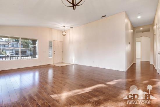 841 Homestead Road Corona, CA 92878 - Photo 8 of 21 a view of a livingroom with wooden floor