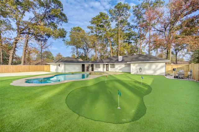 a view of swimming pool with a yard