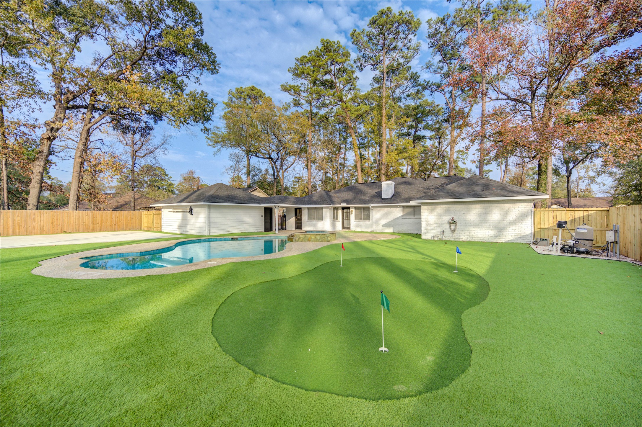 a view of swimming pool with a yard