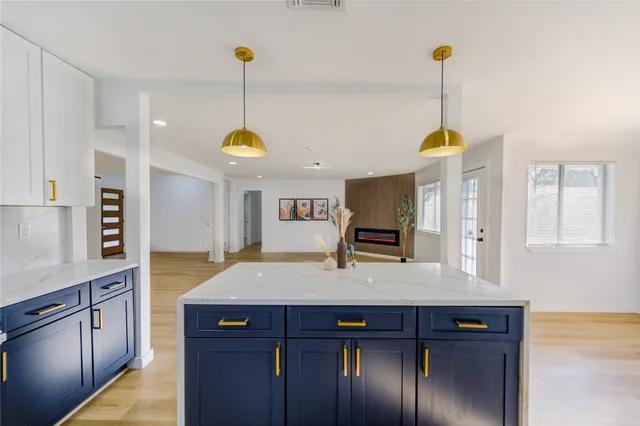 a view of empty room with ceiling fan