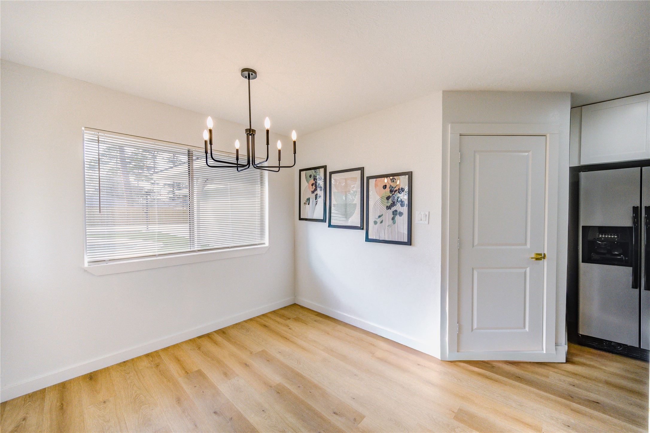 25607 Spring Ridge Drive Spring, TX 77386 - Photo 15 of 50 a view of empty room with wooden floor and fan