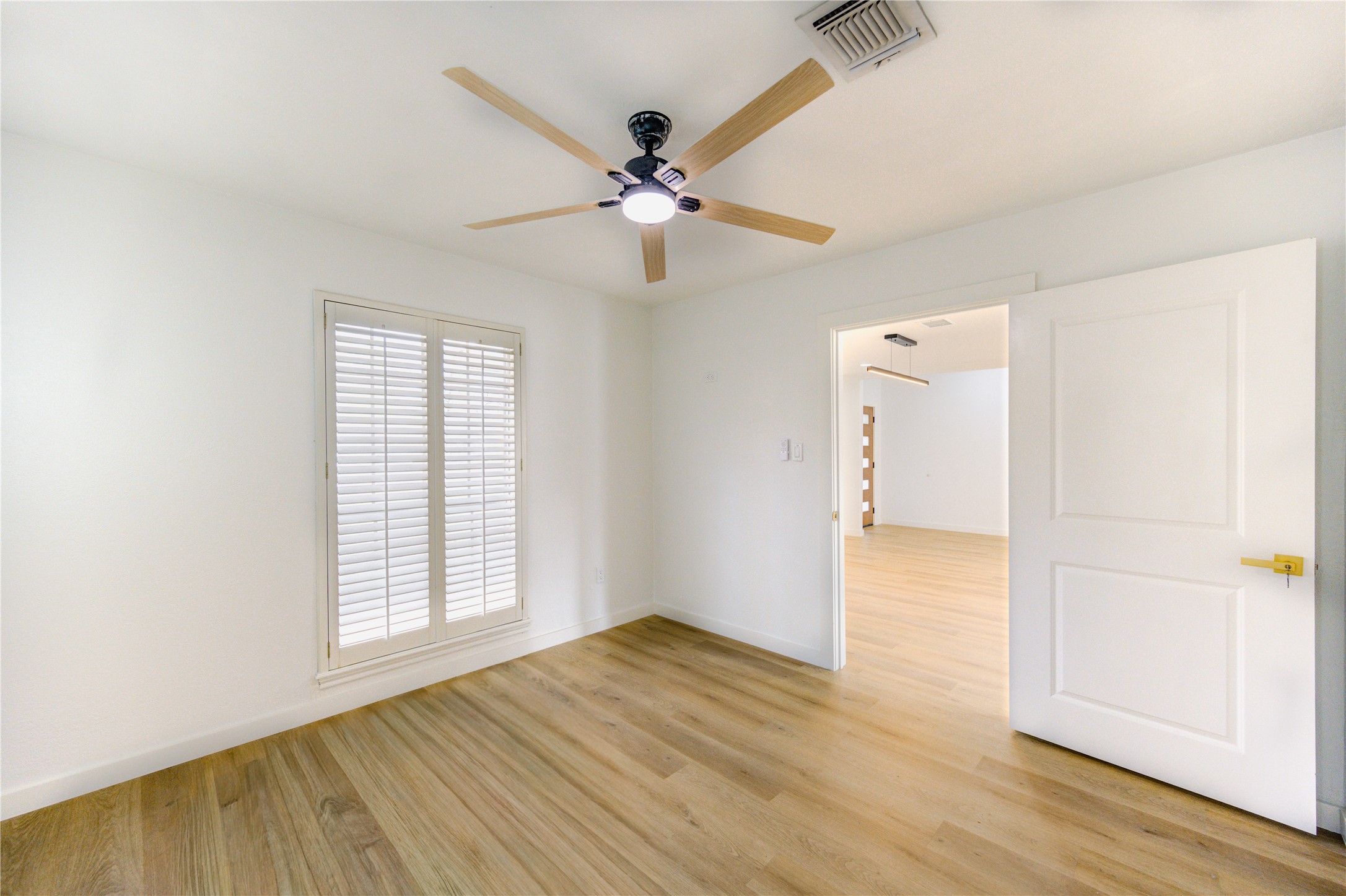 25607 Spring Ridge Drive Spring, TX 77386 - Photo 18 of 50 wooden floor in an empty room with a window
