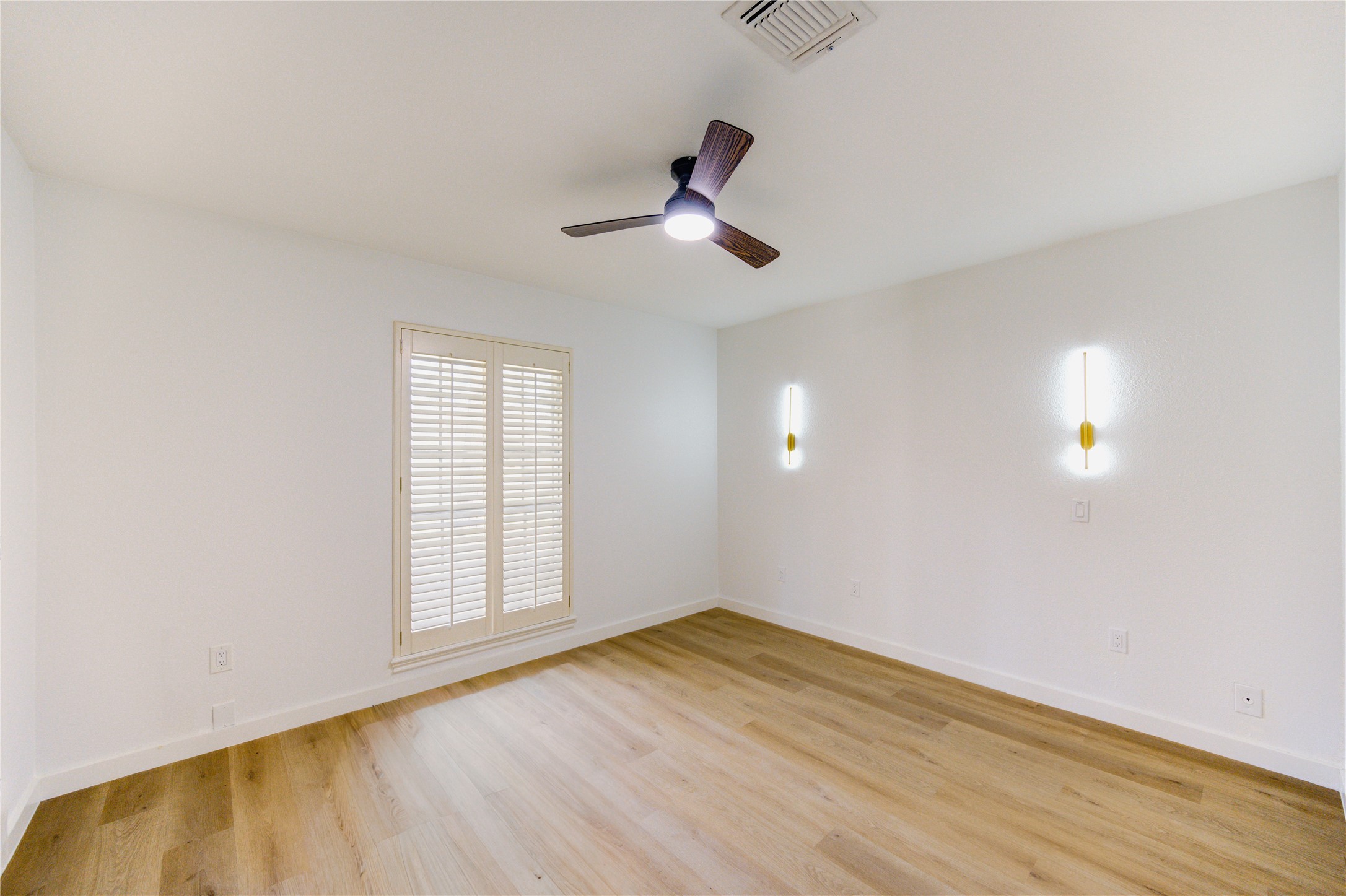 25607 Spring Ridge Drive Spring, TX 77386 - Photo 20 of 50 Bedroom 2 with celing fan, installed nightstand lighting for added style and functionality