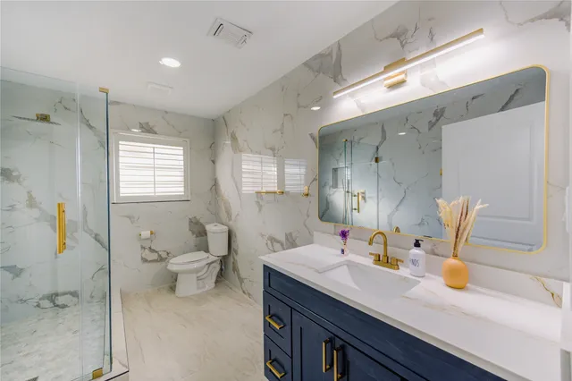 a swimming pool with an outdoor space and seating