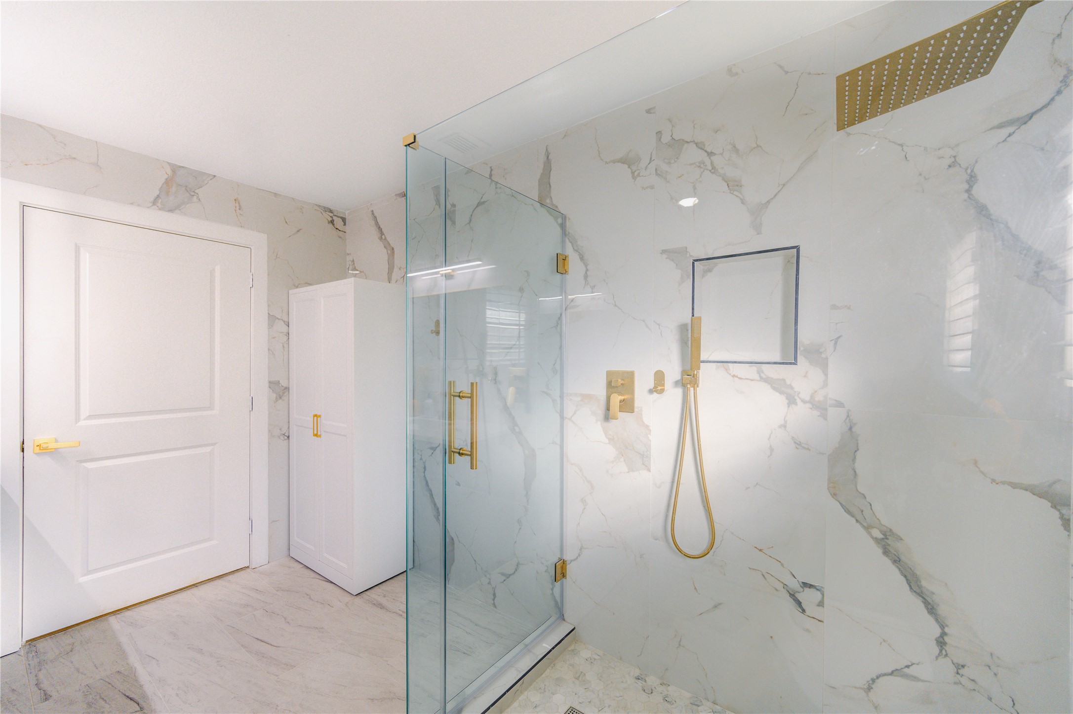 25607 Spring Ridge Drive Spring, TX 77386 - Photo 25 of 50 a bathroom with a glass shower door