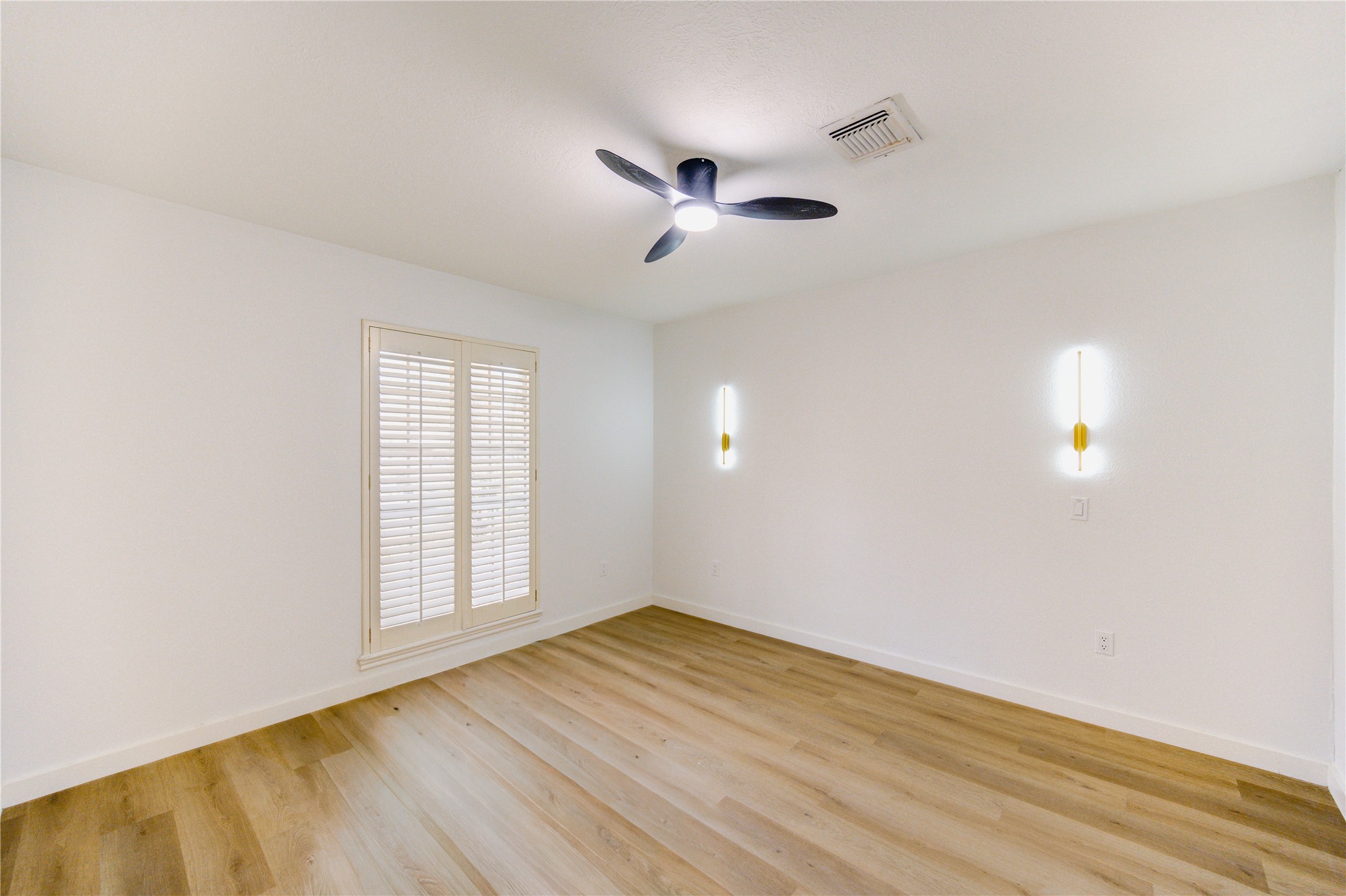25607 Spring Ridge Drive Spring, TX 77386 - Photo 26 of 50 an empty room with wooden floor ceiling fan and windows