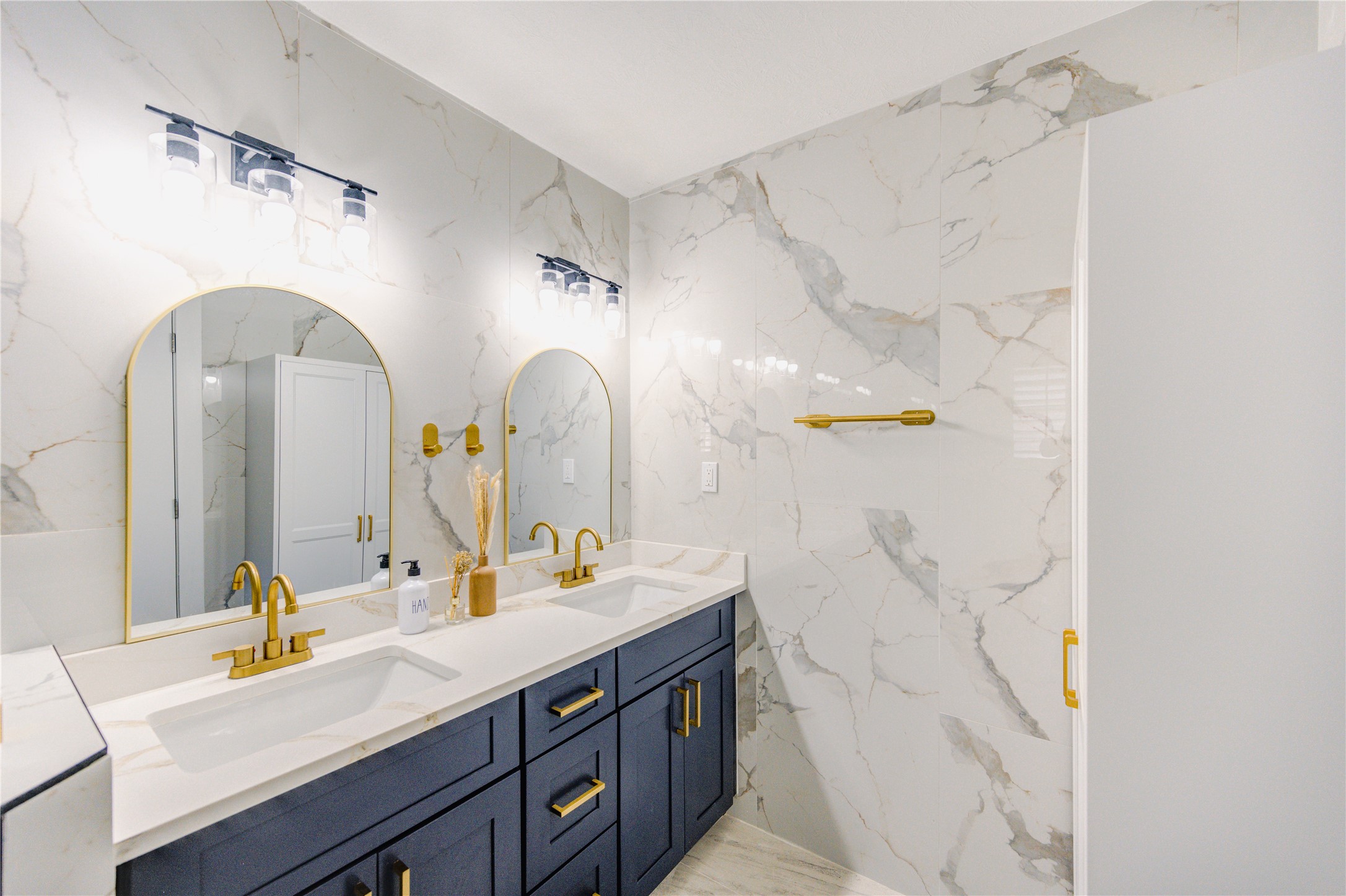 25607 Spring Ridge Drive Spring, TX 77386 - Photo 34 of 50 a spacious bathroom with a double vanity sink and a mirror
