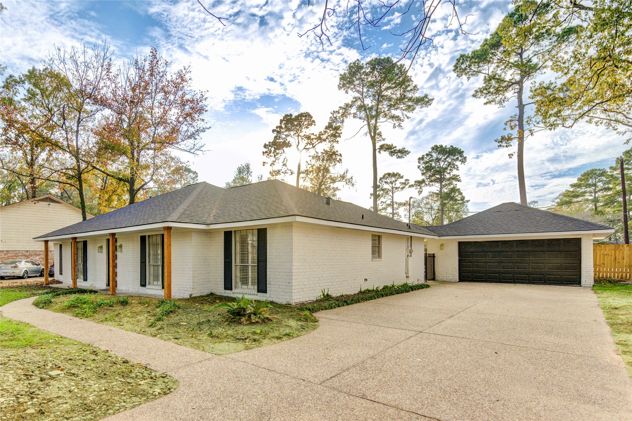 25607 Spring Ridge Drive Spring, TX 77386 - Photo 4 of 50 a white house that has a tree in front of it