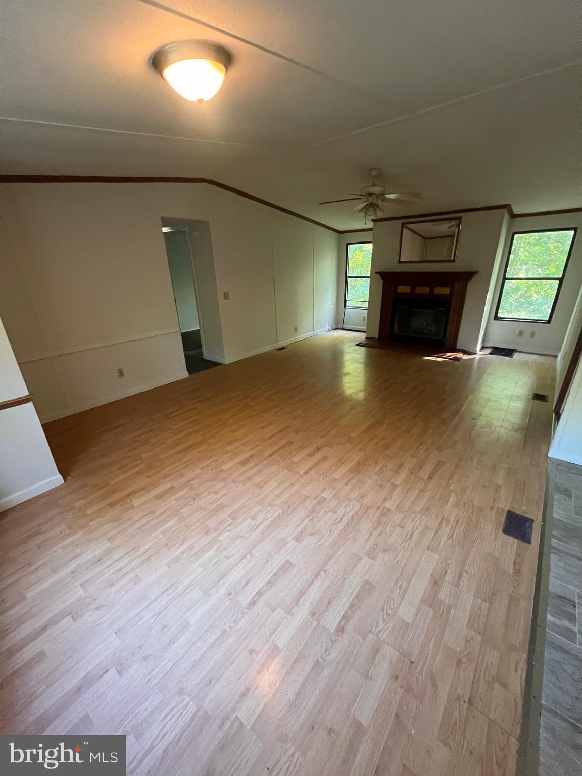 5215 Clark Canning House Road Hurlock, MD 21643 - Photo 2 of 10 a view of empty room with wooden floor