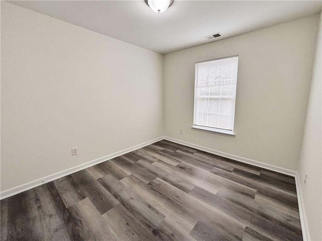 1400 Stonehaven Circle, Unit 1406 Cartersville, GA 30121 - Photo 16 of 21 an empty room with a window