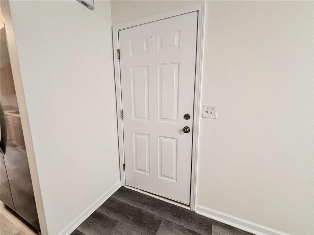 1400 Stonehaven Circle, Unit 1406 Cartersville, GA 30121 - Photo 3 of 21 an empty room with wooden floor