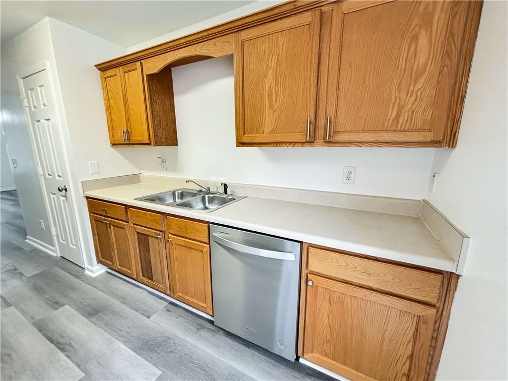 1400 Stonehaven Circle, Unit 1406 Cartersville, GA 30121 - Photo 7 of 21 a utility room with granite countertop cabinets washer and dryer