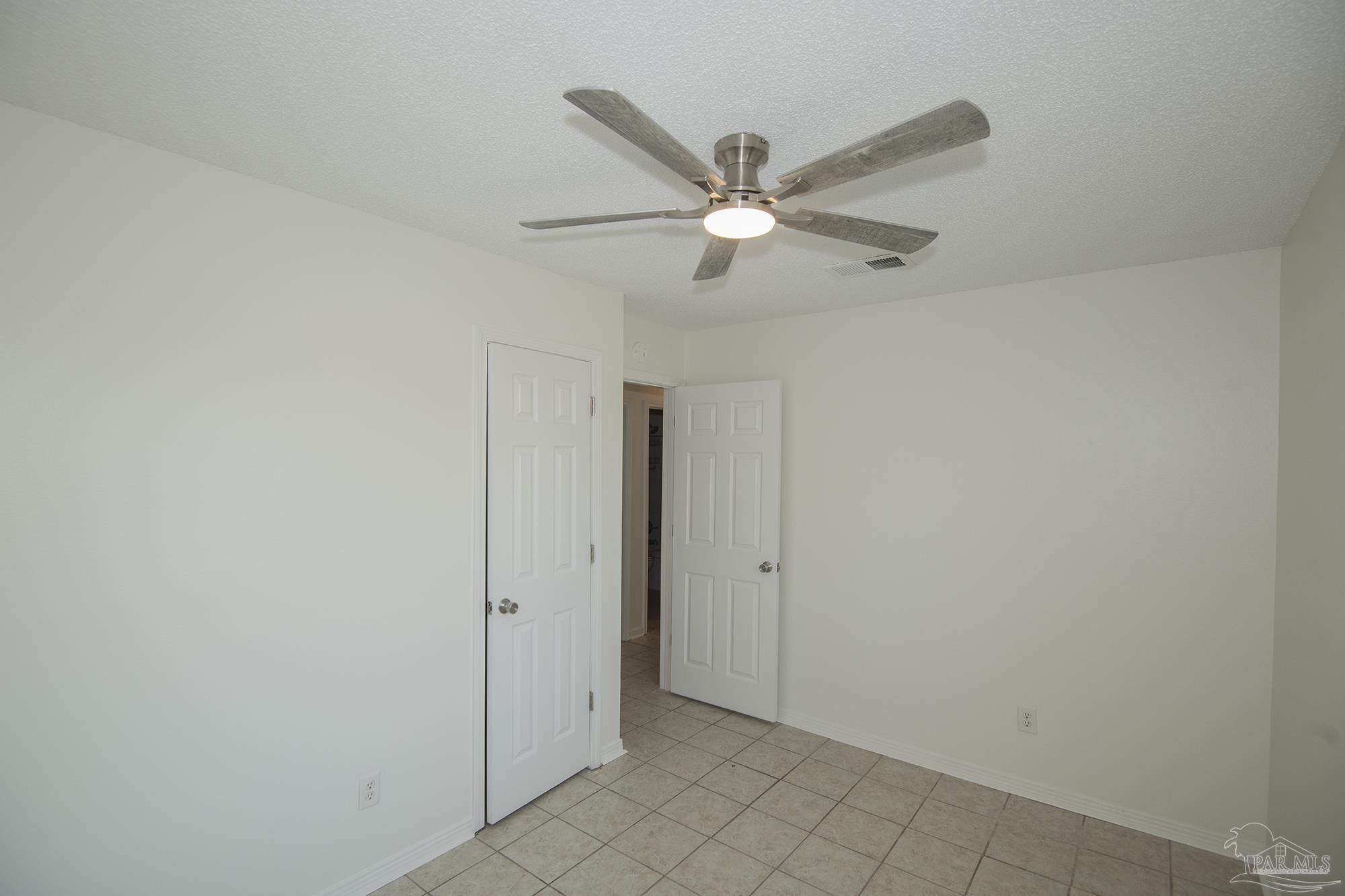 5578 Cyanamid Road Milton, FL 32583 - Photo 11 of 33 an empty room with closet and a ceiling fan
